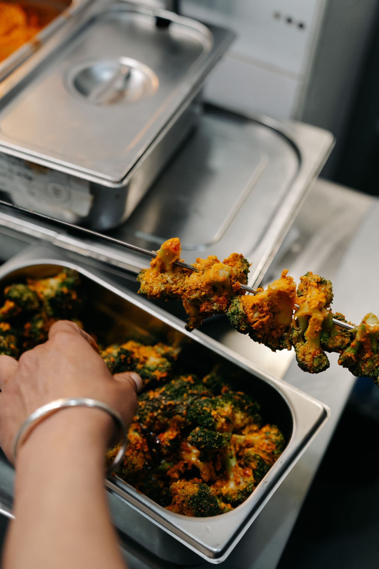 Chef Nand Kishor carefully plating a dish at Koyal