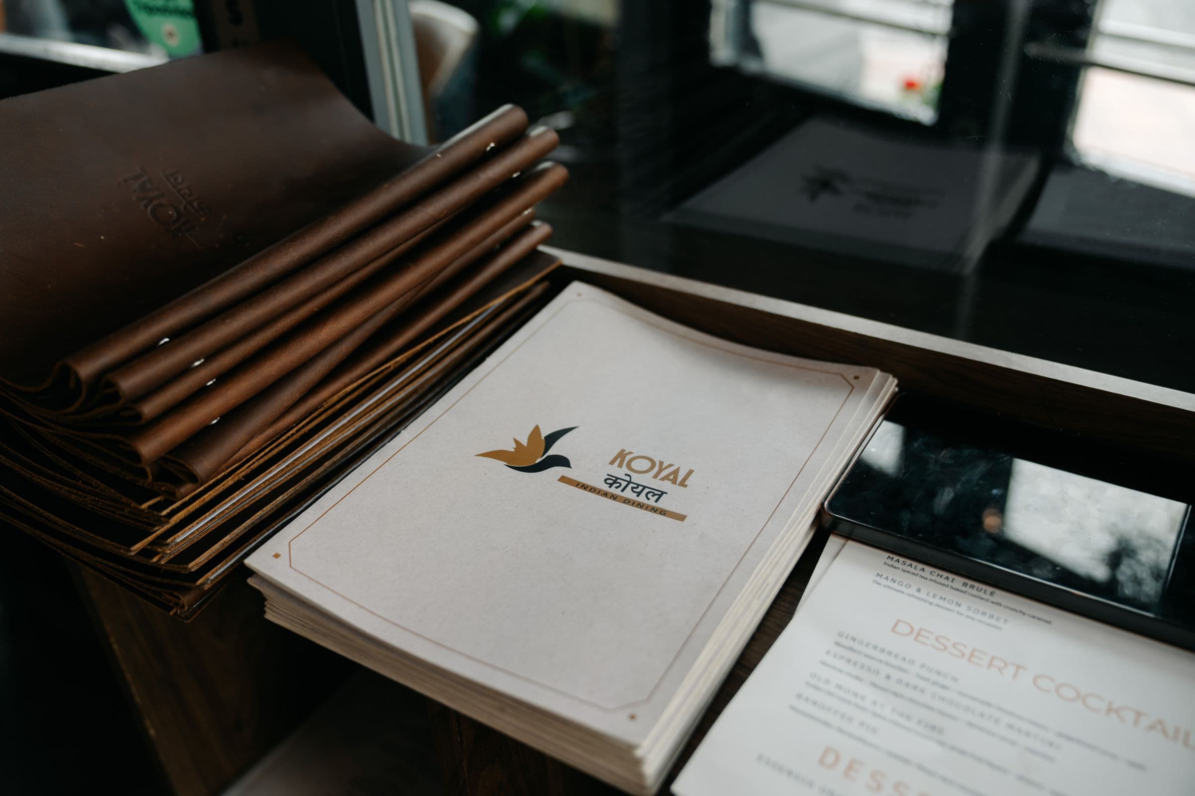 Koyal leather menu with dishes