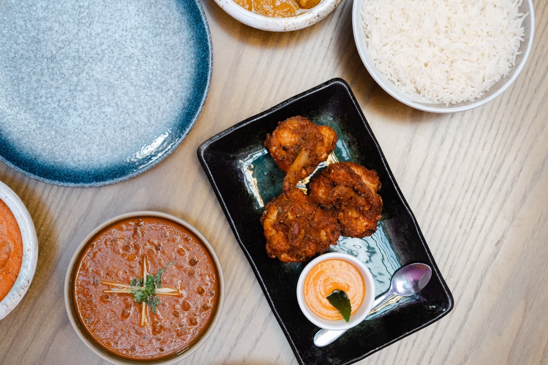 Coastal Indian prawn dish with rice at Koyal Indian restaurant in Surbiton