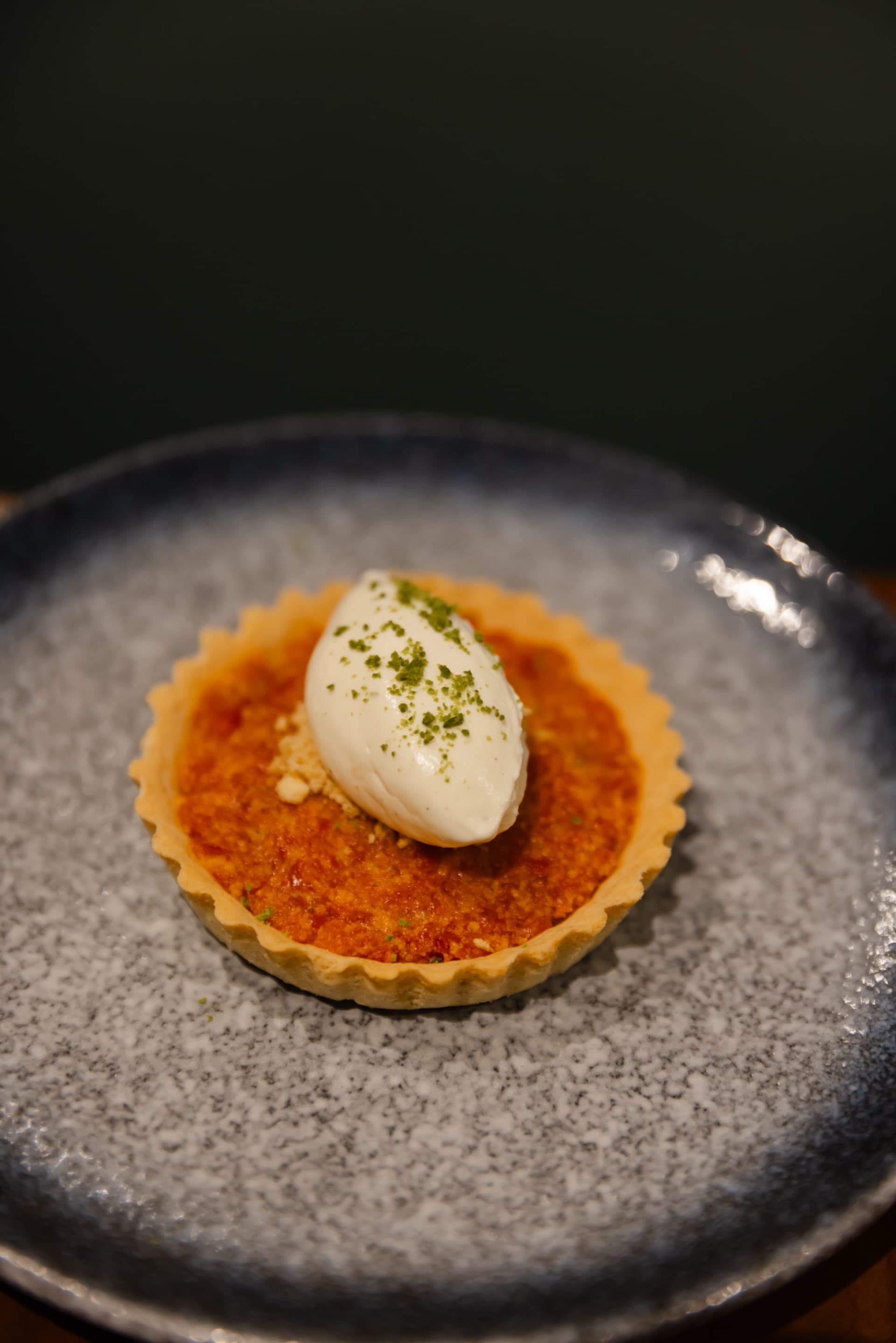 Dessert tart with cream served as the final whisky pairing course at Koyal